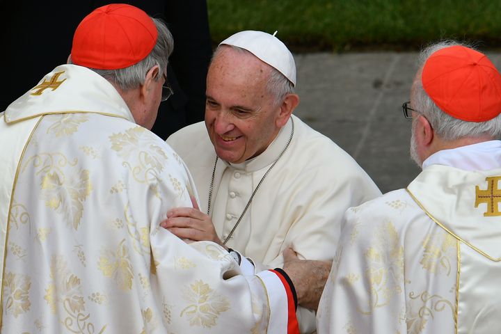 Pell, left, is greeted by Pope Francis in November 2016 at the Vatican 
