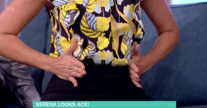 Holly Willoughby demonstrating what a bump looks like if you're expecting a boy.