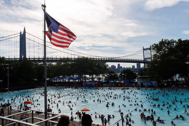 People enjoy a day in the pool during a heat wave in the Queens borough of New York City, July 24, 2016.