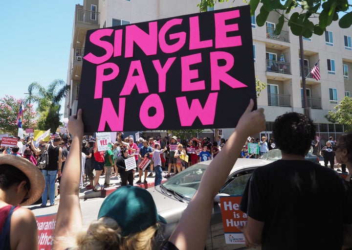 Protesters gather earlier this week outside California Assembly Speaker Anthony Rendon's district office in Los Angeles County.