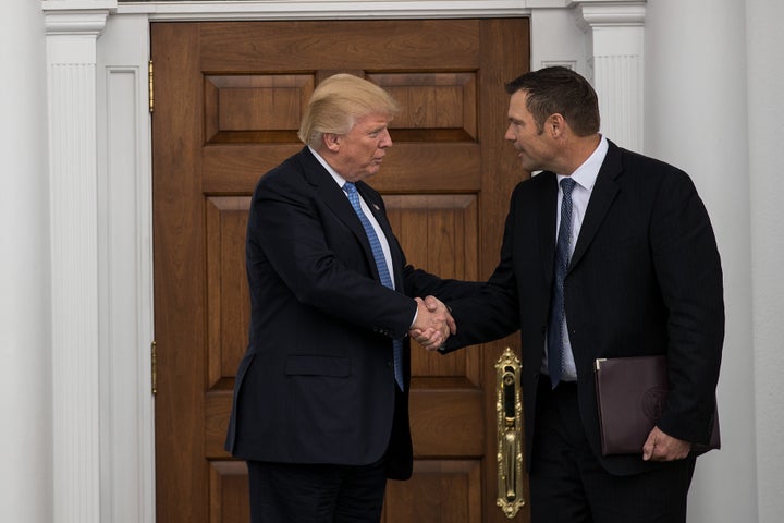 Then-President-elect Donald Trump and Kris Kobach, Kansas secretary of state, shake hands following their meeting at Trump International Golf Club on Nov. 20, 2016, in Bedminster Township, New Jersey.