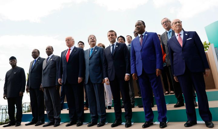 World leaders pose for a family photo of G7 leaders.