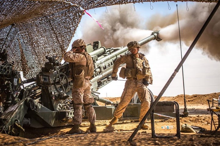 Marines with the 11th Marine Expeditionary Unit fire an M777 Howitzer during a fire mission in northern Syria as part of Operation Inherent Resolve, March 24, 2017.