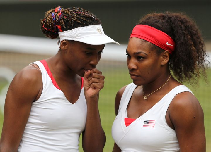Serena and Venus Williams during their Olympic doubles final match at Wimbledon at the London 2012 Olympics