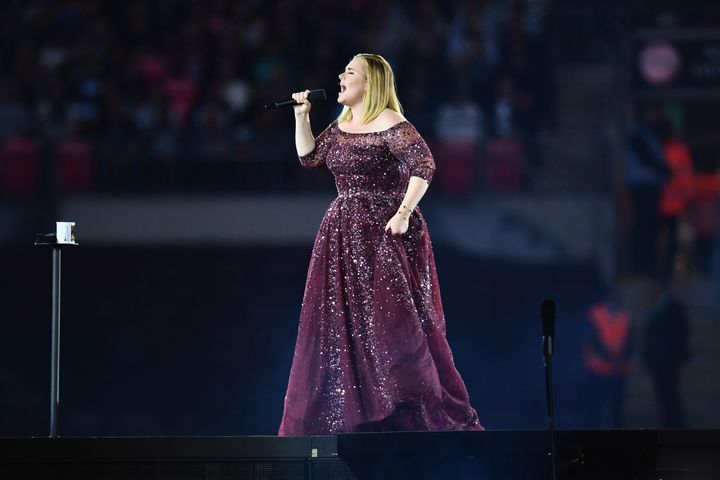 Adele on stage at Wembley Stadium, probably not swearing mid-song