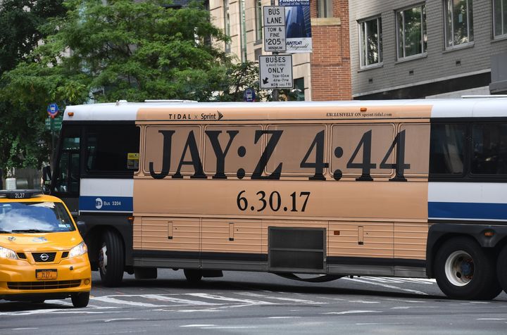 A New York City bus features an advertisement for Jay-Z's new album "4:44."