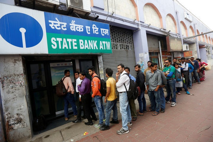 People queue outside an ATM of State Bank of India (SBI) in Kolkata, India. REUTERS/Rupak De Chowdhur