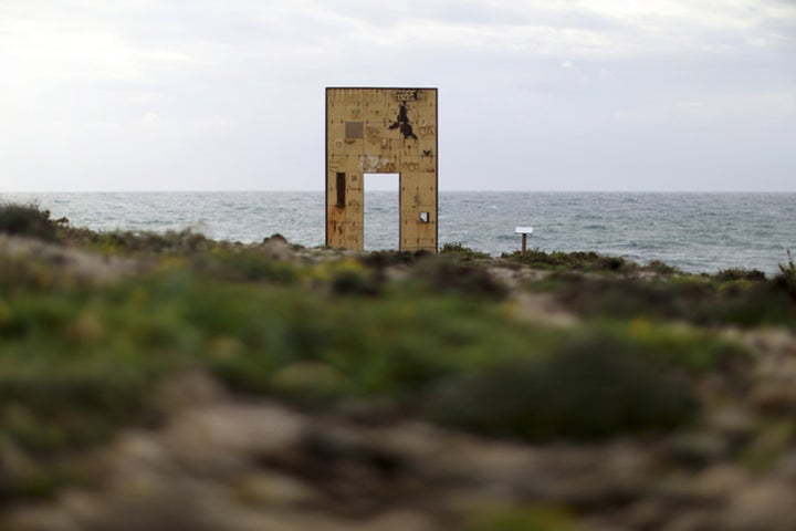 The “Door of Europe” monument, which commemorates migrants who died on their journey, is seen on the southern Italian island