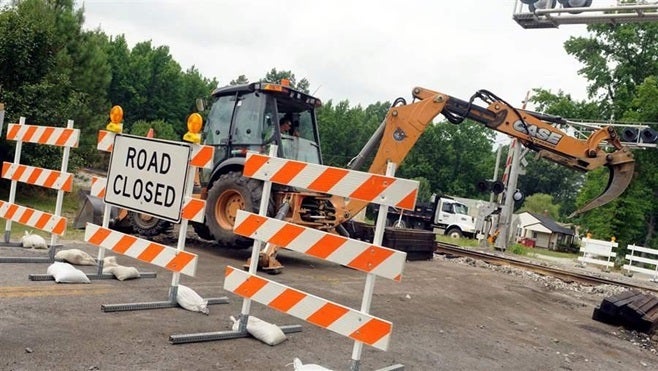 A crew conducts maintenance work on a railroad crossing in Chesterfield County, Virginia. Virginia’s Department of Transportation is using apprenticeships to train workers for road construction and maintenance jobs.