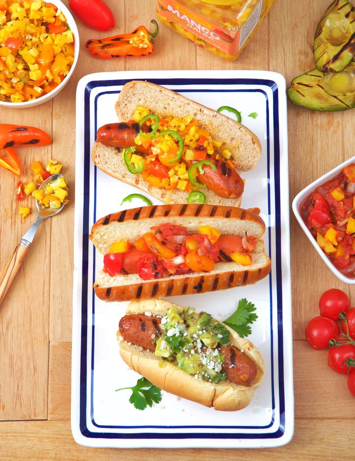 From top to bottom: Mango, Sweet Pepper & Corn Relish on Chorizo; Cherry Tomato, Yellow Pepper & Red Onion Relish on Jumbo Beef; and Grilled Avocado, Coriander & Sweet Onion Relish on Chicken.