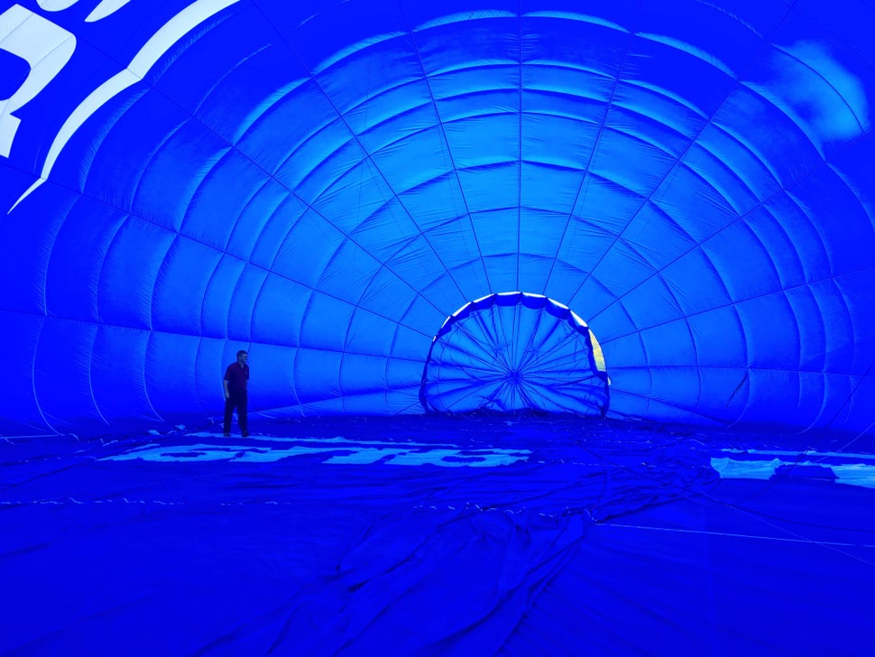 The balloon is huge - as can be seen by the pilot checking the inside before lift-off. 