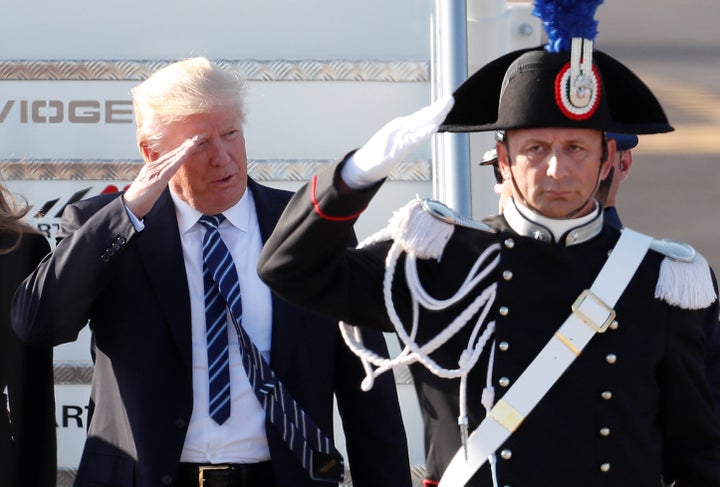 President Donald Trump salutes as he arrives at the Leonardo da Vinci-Fiumicino Airport in Rome, Italy, May 23, 2017