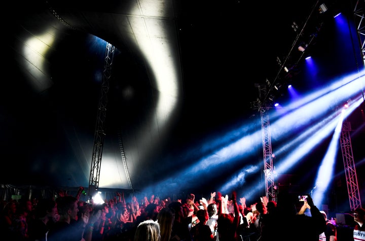 The audience dances during Sweden's Bravalla Festival in Norrkoping on June 29. The festival's organizer said Saturday that next year's event would be canceled in light of several reports of sexual violence at this year's gathering.