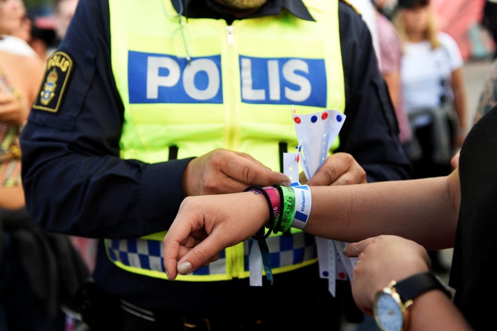 Police officers handed out bracelets with the words