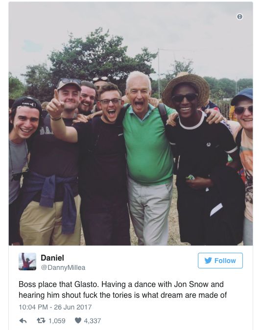 Jon Snow posing with fans at Glastonbury.