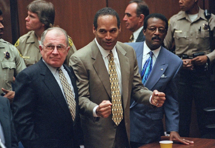 “O.J. Simpson reacts in 1995 as he is found not guilty of murdering his ex-wife, Nicole Brown Simpson, and her friend Ronald Goldman. With him are members of his defense team, F. Lee Bailey, left, and Johnnie Cochran Jr.” -LA Times 