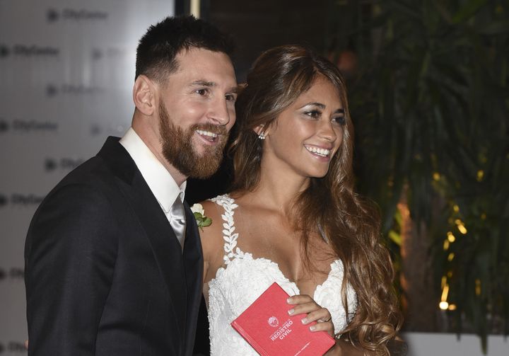 Lionel Messi and Antonela Roccuzzo greet the press after their civil wedding ceremony at the City Center Rosario Hotel & Casino on 30 June 2017 in Rosario, Argentina.