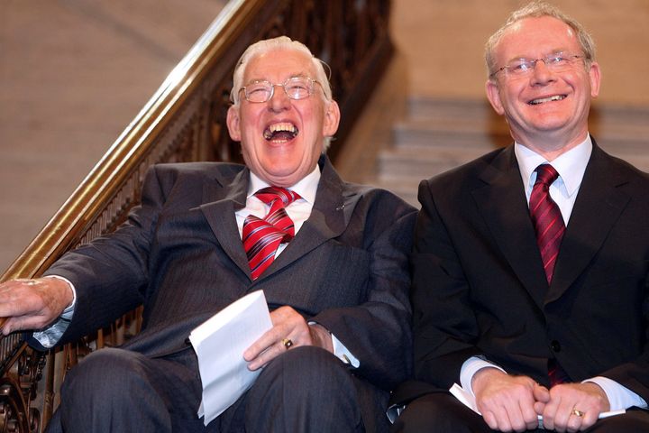 UNITED KINGDOM - MAY 08: Northern Ireland First Minister Ian Paisley, left, and Martin McGuinness, deputy first minister, share a joke at Stormont in Belfast, U.K., Tuesday, May 8, 2007. Paisley ended a lifetime of opposition today when he became leader of the British province in a government that includes his political rivals in Sinn Fein, the political wing of the Irish Republican Army. (Photo by Paul Faith/Bloomberg via Getty Images) Bloomberg via Getty Images