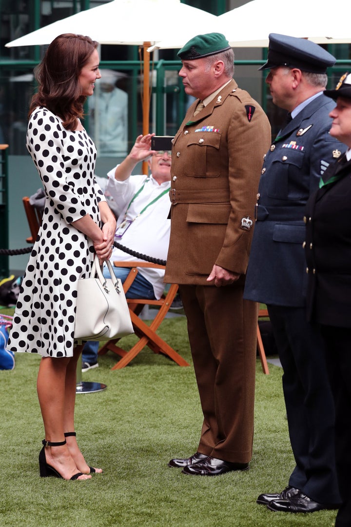 Catherine, Duchess of Cambridge, meets with servicemen and servicewomen as she visits The All England Lawn Tennis Club in Wimbledon, south-west London, on 3 July 2017 on the first day of the 2017 Wimbledon Championships. 