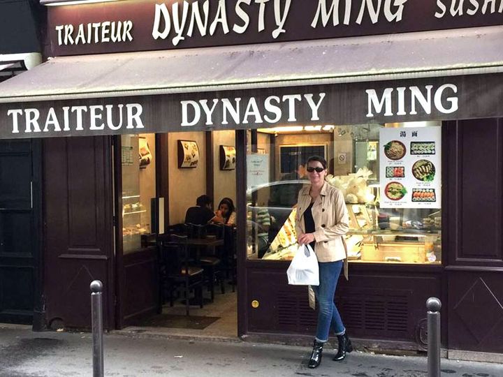 Standing outside of the Dynastry Ming restaurant, one of my favorite places to grab take-out in Paris.