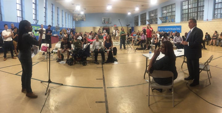 <p>Alisha Williams of 5 Boro Defenders, grills Brooklyn DA Eric Gonzalez at the Sunset Park Broken Windows Town Hall</p>