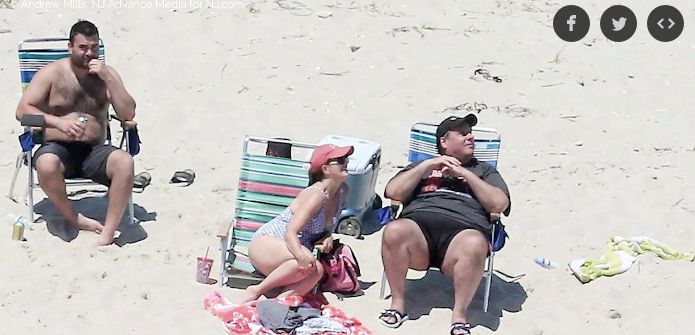 New Jersey Gov. Chris Christie (R) relaxes on the beach he closed to the public. 