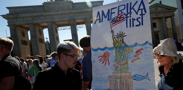 <p>Protests at the Brandenburg Gate, in Berlin, against the US withdrawal from the Paris climate change deal. </p>