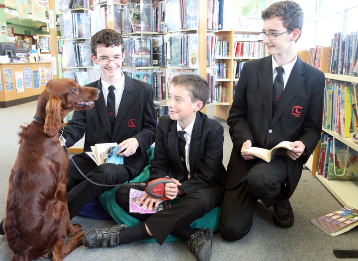 Shola in the library with students. 