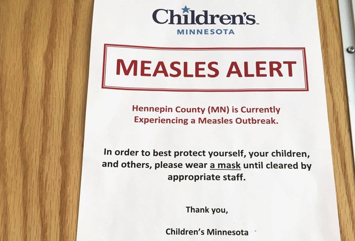 A sign at Children's Minnesota alerts patients to a measles outbreak. 