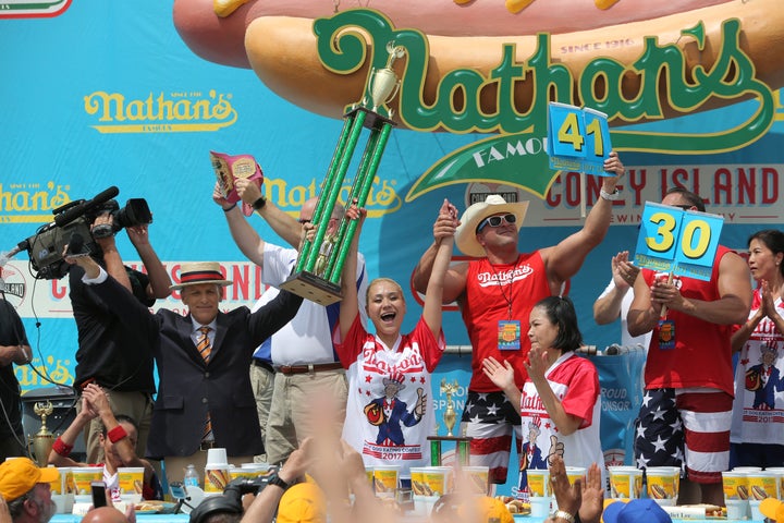 Miki Sudo celebrates winning this year's Nathan's Famous Fourth of July International Hot Dog-Eating Contest, in the women's division, after gobbling 41 hot dogs and buns.