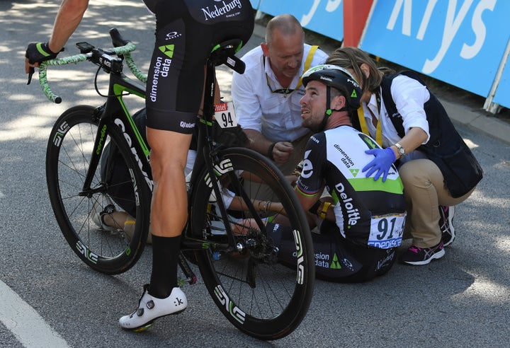 Dimension Data rider Mark Cavendish of Britain gets medical assistance after his crash next to the finish line in Vittel, Fra
