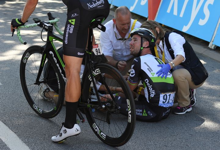 Dimension Data rider Mark Cavendish of Britain gets medical assistance after his crash next to the finish line in Vittel, France, on Tuesday.
