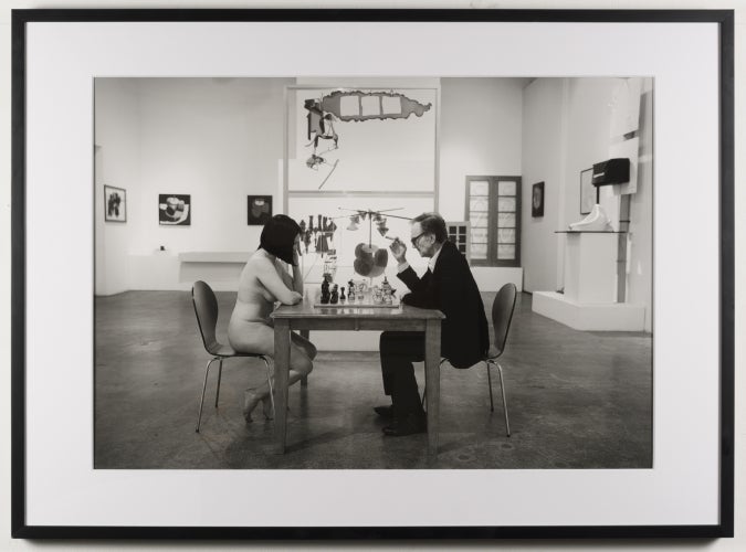 <p>John Colao: After Julian Wasser: Julian Wasser Playing Chess with a Nude at Robert Berman Gallery, 2016. Archival pigment print, mounted to dibond. Signed by both John Colao and Julian Wasser </p>