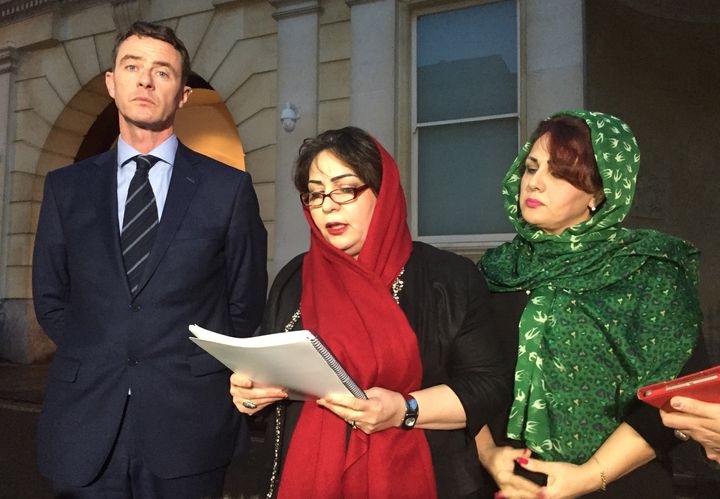 Ebrahimi's sisters Manizhah Moore (c) and Ladin Ebrahimi make a statement outside Bristol Crown Court with Tony Murphy of Bhatt Murphy Solicitors