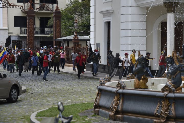 Supporters of Venezuelan President Nicolas Maduro storm the National Assembly building in Caracas on July 5, 2017.