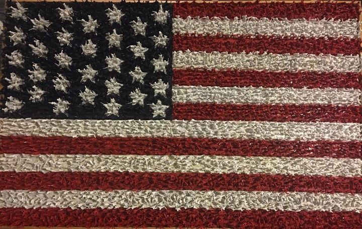 This 5-foot by 3-foot American flag is made up of more than 10,000 plastic Army men.
