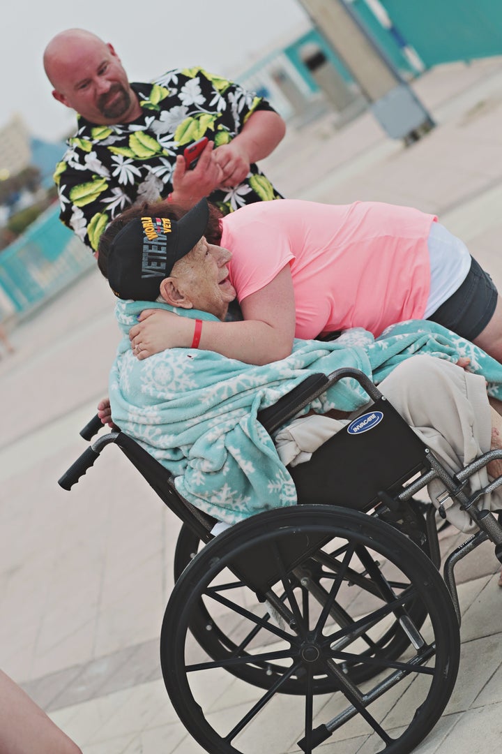 Grandpa gets a hug. 