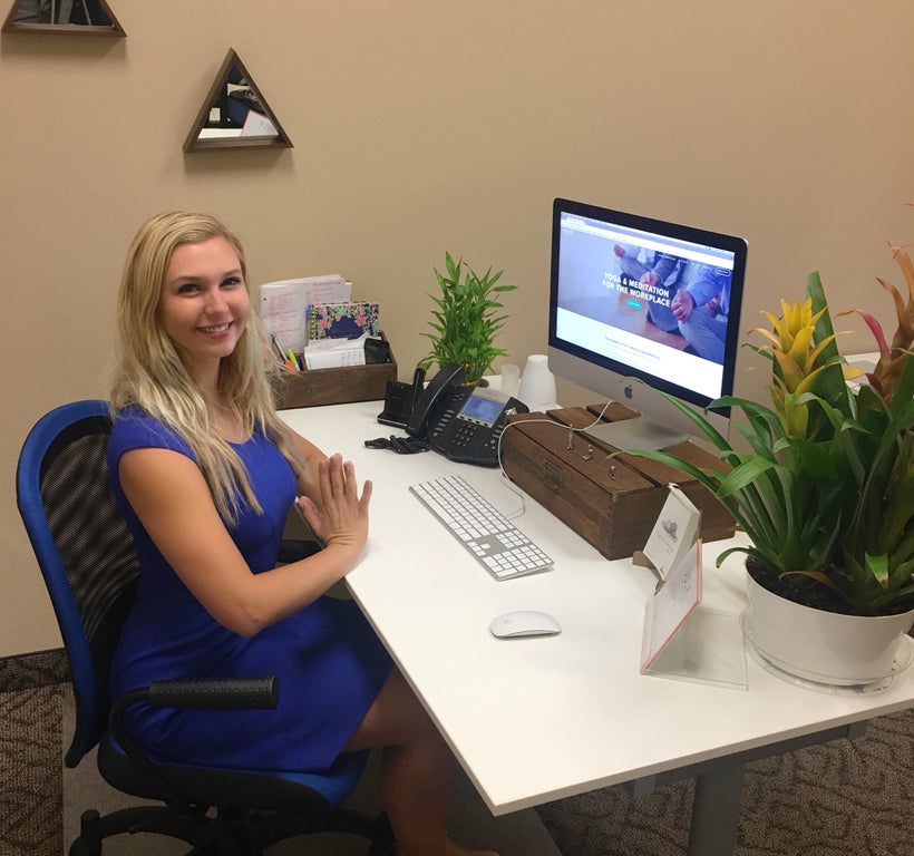 Nomad Corporate Yoga CEO Claudia Padgett at her desk in Las Vegas, Nevada