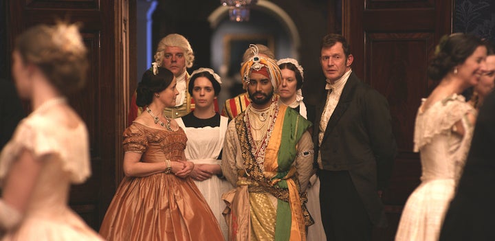 Satinder Sartaaj as The Black Prince, flanked by Amanda Root as Queen Victoria, Jason Flemyng as Doctor John Login, and Duleep Singh's guardian, in England.