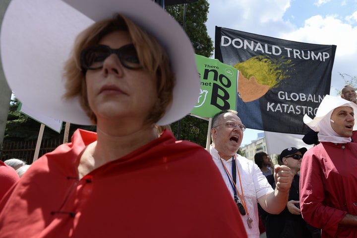 People protest against US President Donald Trump outside the Krasinskich Square in Poland. 