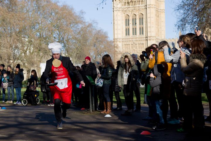 Robbie Gibb, pictured taking part in a charity pancake race at parliament in 2015, has been at the BBC for more than two decades