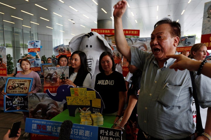 Pro- and anti-ivory trade protesters clash outside a hearing for Hong Kong's new ivory bill on June 6.