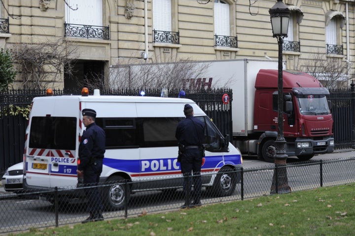 Police officers search Teodorin's Paris residence. Feb. 14, 2012.