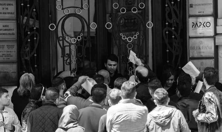 Syrians waiting for an appointment outside the gates of the Syrian consulate in Istanbul, Turkey on May 5, 2017.