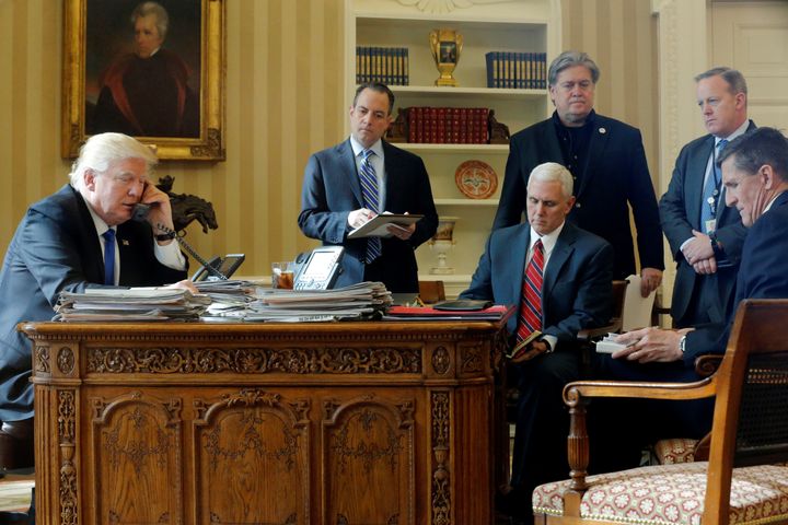 President Donald Trump speaks by phone with Russia's President Vladimir Putin from the Oval Office on Jan. 28. He is joined by (left to right) Chief of Staff Reince Priebus, Vice President Mike Pence, senior adviser Steve Bannon, press secretary Sean Spicer and then-national security adviser Michael Flynn.