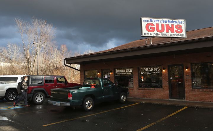 A customer approaches the closed Riverview Gun Sales shop on December 21, 2012 in East Windsor, Connecticut.