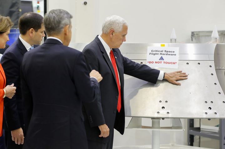 Mike Pence ignored a "Do No Touch" sign on a piece of hardware during a tour of the Kennedy Space Center's Operations and Checkout Building on Thursday.