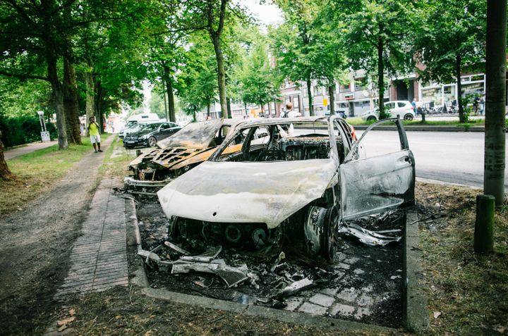 Photos show a number of burned out cars in the city following Thursday night's violent protests 