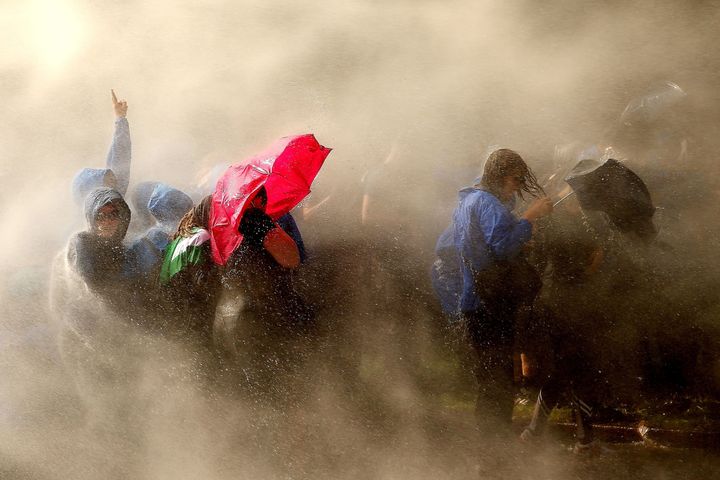 Photos capture soaked protesters in Hamburg 