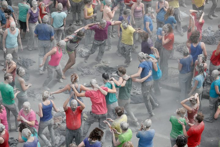 Protesters dance together in the street 